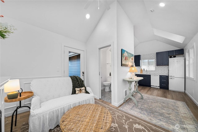 interior space featuring dark hardwood / wood-style flooring and vaulted ceiling