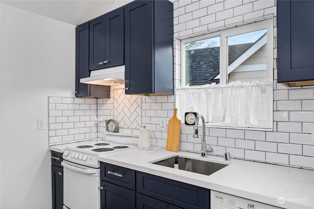 kitchen featuring decorative backsplash, sink, white appliances, and blue cabinets