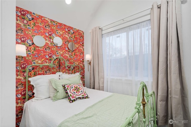 bedroom featuring vaulted ceiling