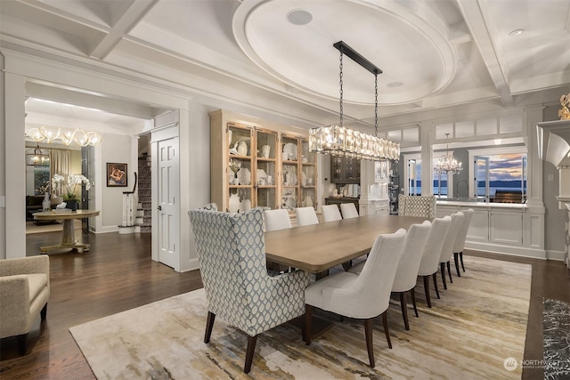 dining space featuring beam ceiling, coffered ceiling, and hardwood / wood-style floors