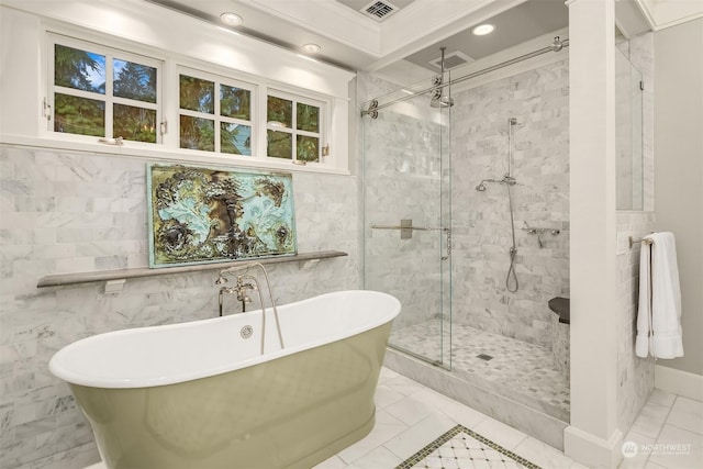 bathroom featuring tile walls, crown molding, and separate shower and tub