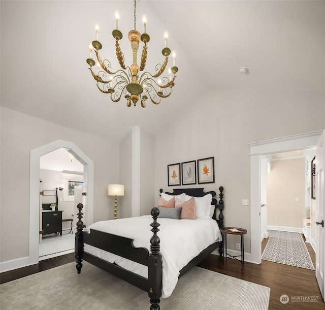 bedroom featuring vaulted ceiling, a notable chandelier, and dark wood-type flooring