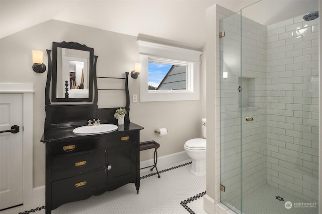 bathroom with toilet, an enclosed shower, tile patterned flooring, and vanity