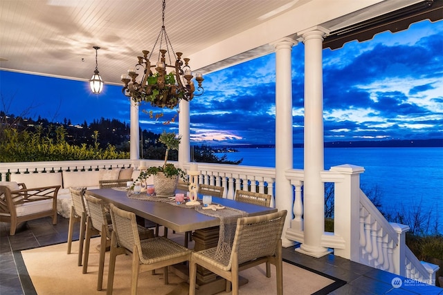 patio terrace at dusk with a water view