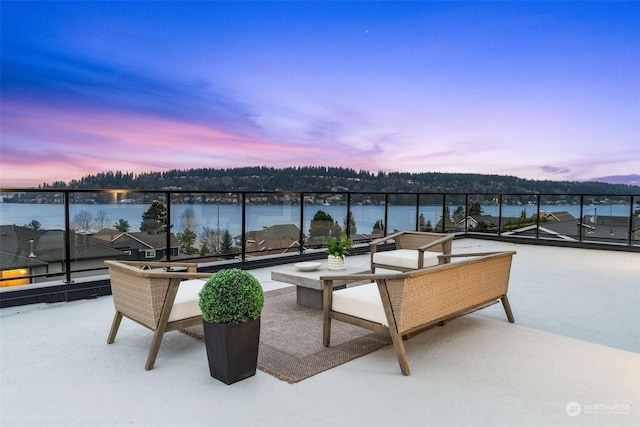 patio terrace at dusk with a water view