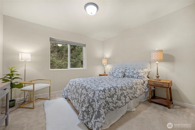 carpeted bedroom featuring baseboards