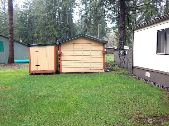 view of outdoor structure featuring a yard