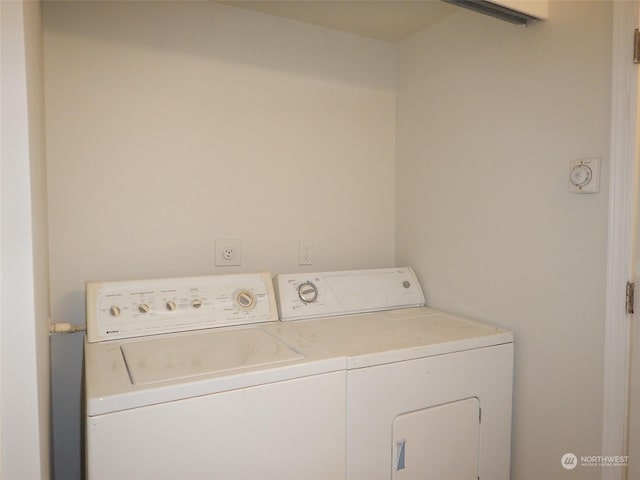 laundry room with washing machine and clothes dryer