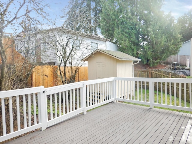 wooden deck with a storage shed