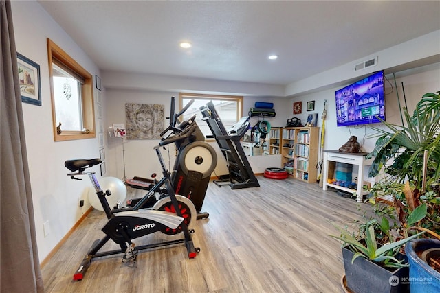 exercise area featuring light hardwood / wood-style flooring