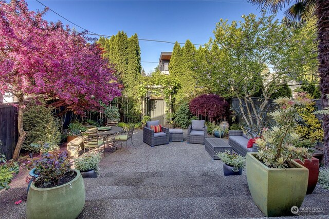 2031 42nd Ave E, Seattle, WA 98112 - fenced backyard with a patio and an outdoor hangout area