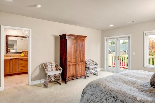 2031 42nd Ave E, Seattle, WA 98112 - bedroom featuring light colored carpet, access to outside, ensuite bath, recessed lighting, and a chandelier