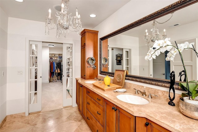 2031 42nd Ave E, Seattle, WA 98112 - full bathroom featuring a chandelier, double vanity, a walk in closet, and recessed lighting