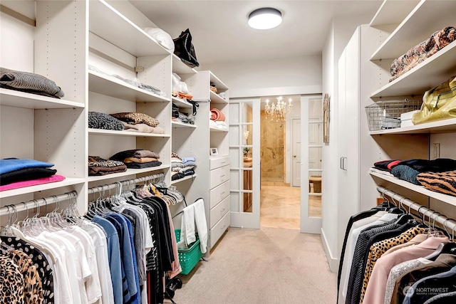2031 42nd Ave E, Seattle, WA 98112 - walk in closet with light carpet and a chandelier