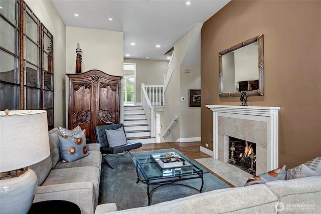 2031 42nd Ave E, Seattle, WA 98112 - living room featuring stairway, wood finished floors, a high end fireplace, and recessed lighting