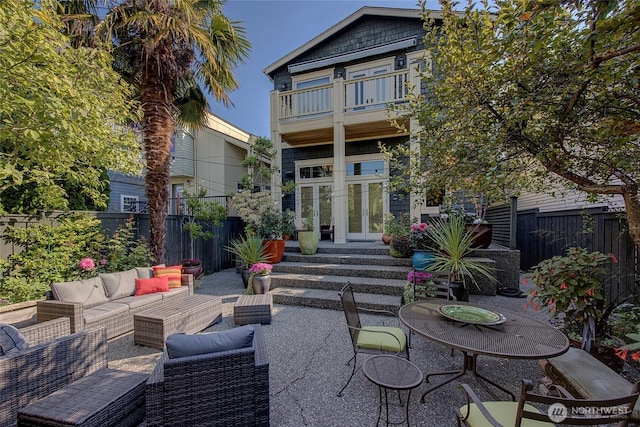 2031 42nd Ave E, Seattle, WA 98112 - rear view of property with a balcony, french doors, an outdoor living space, and a fenced backyard