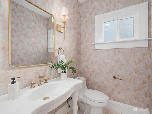 bathroom featuring sink and toilet