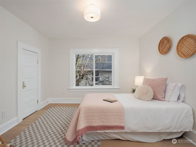 bedroom with light hardwood / wood-style flooring