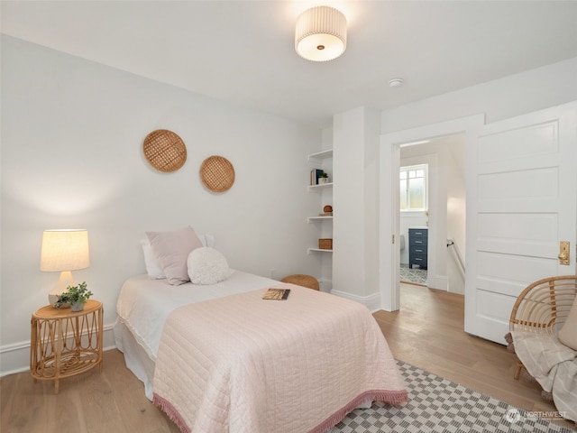 bedroom featuring light wood-type flooring