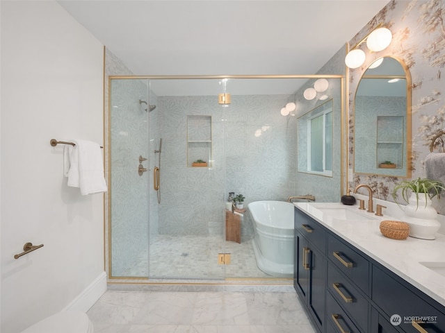 bathroom featuring vanity and shower with separate bathtub