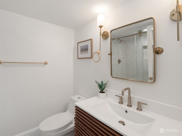 bathroom with a shower, vanity, and toilet