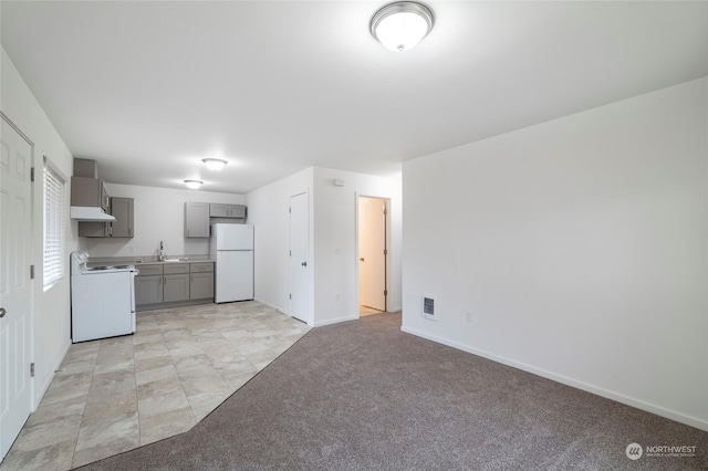 243 23rd Ave Unit 1-9, Longview, WA 98632 - kitchen featuring white appliances, gray cabinets, light carpet, ventilation hood, and light countertops