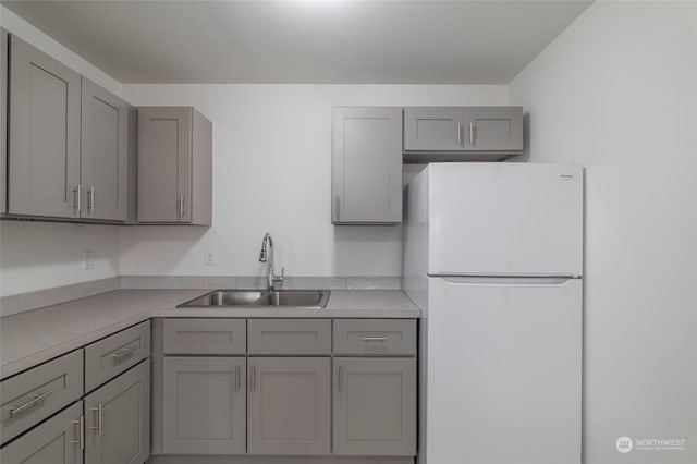 243 23rd Ave Unit 1-9, Longview, WA 98632 - kitchen with freestanding refrigerator, gray cabinets, and light countertops