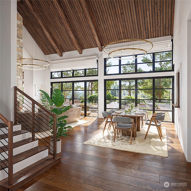 unfurnished sunroom with vaulted ceiling with beams and wooden ceiling