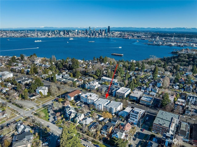 birds eye view of property with a water view