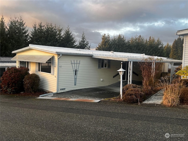 view of front of house featuring a carport