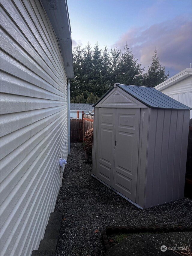 view of outdoor structure at dusk