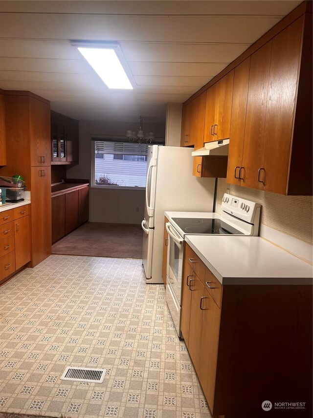 kitchen with white range with electric cooktop