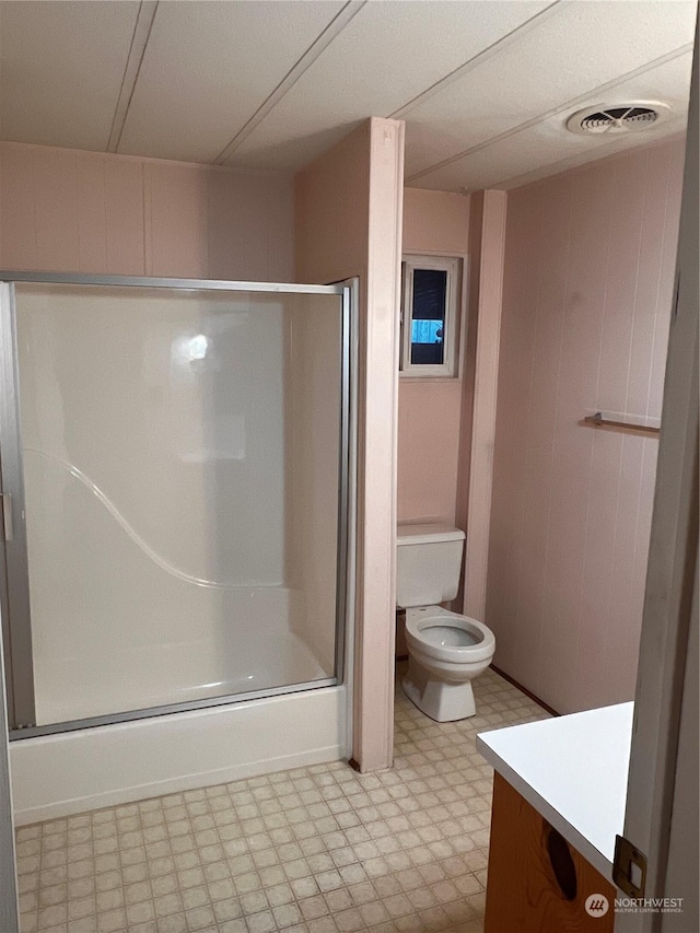 full bathroom featuring vanity, toilet, and bath / shower combo with glass door