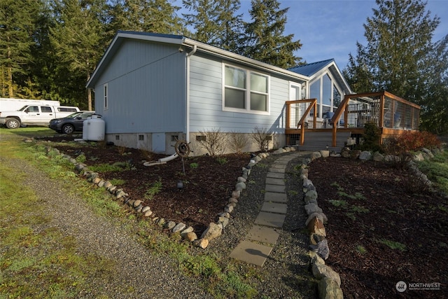 view of home's exterior with a deck