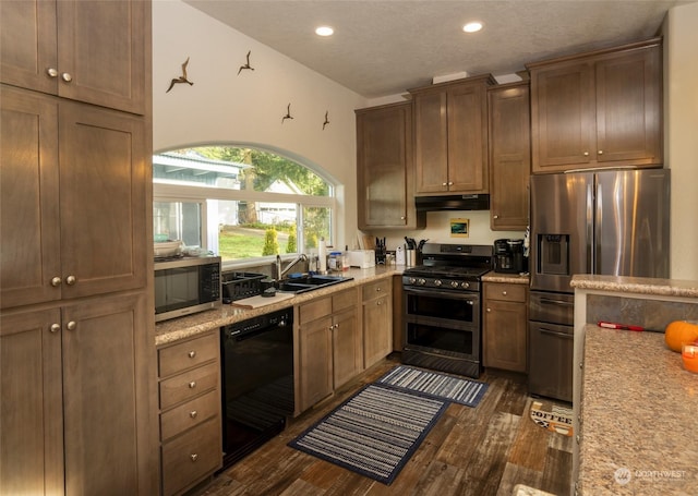 kitchen featuring dark hardwood / wood-style flooring, sink, and appliances with stainless steel finishes