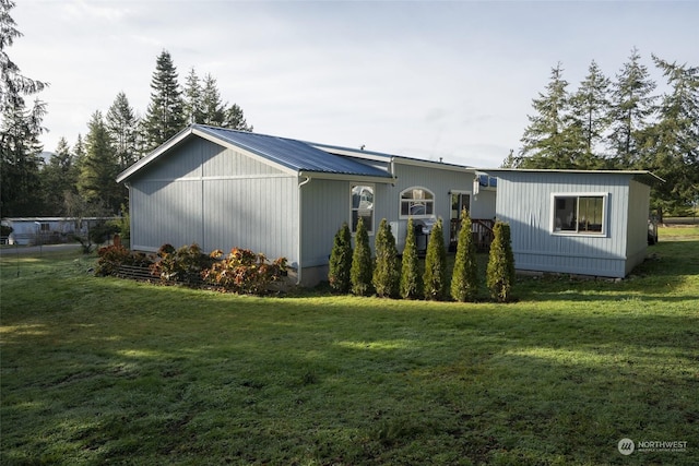 view of property exterior featuring a yard