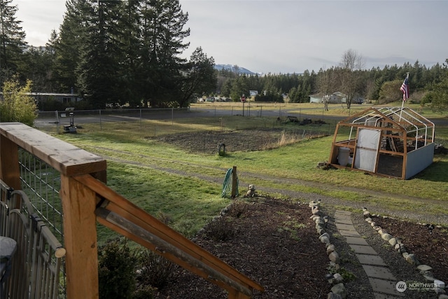 view of yard featuring a rural view and an outdoor structure