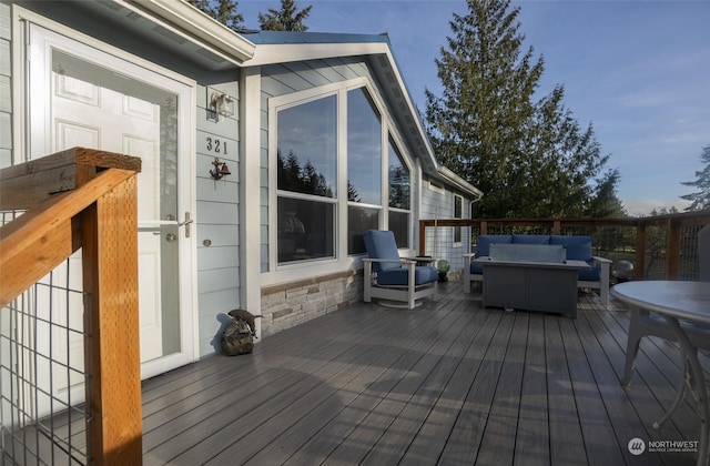 deck with an outdoor hangout area