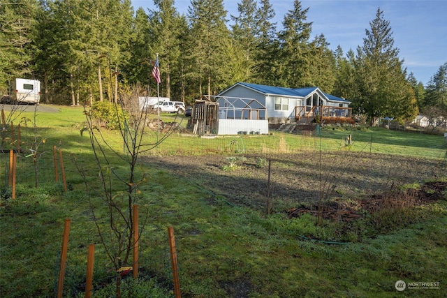 view of yard featuring a wooden deck