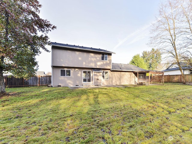 rear view of house with a lawn