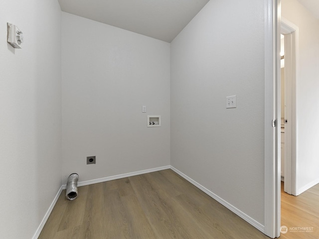 laundry room featuring hookup for a washing machine, hardwood / wood-style floors, and hookup for an electric dryer