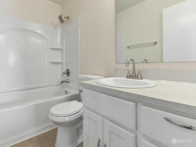 full bathroom with vanity, toilet, wood-type flooring, and shower / washtub combination