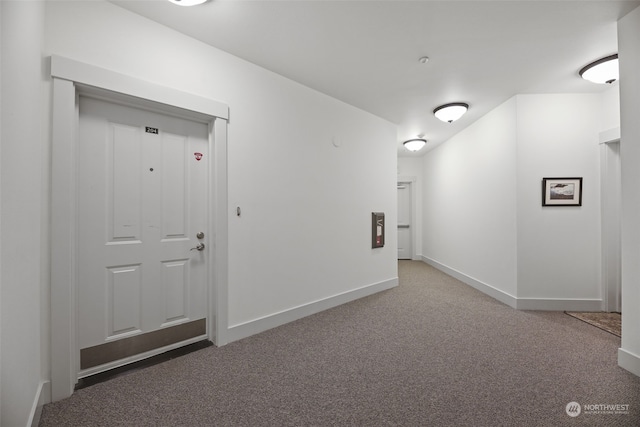 hall with carpet flooring