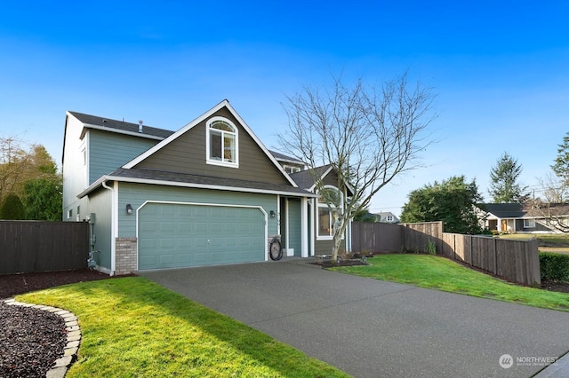 view of front facade featuring a garage and a front lawn