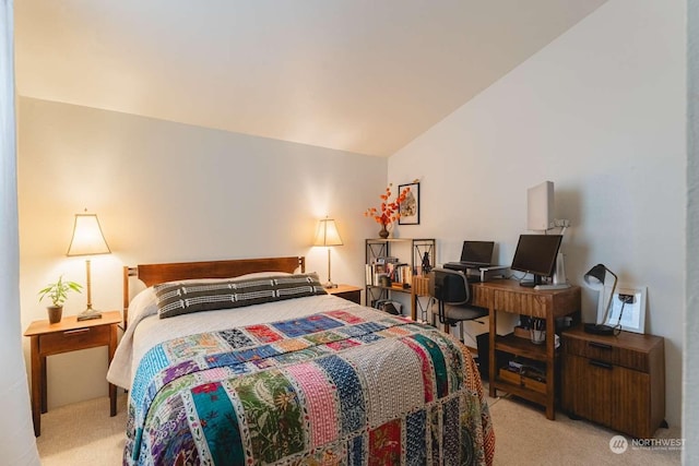 carpeted bedroom featuring vaulted ceiling