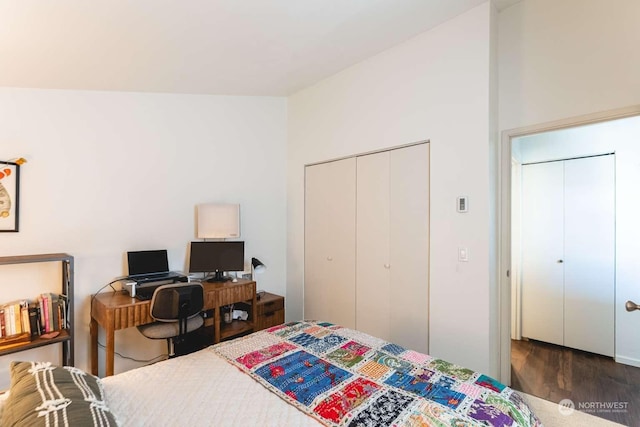 bedroom with a closet and dark hardwood / wood-style flooring