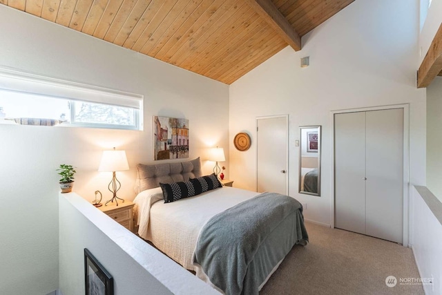 carpeted bedroom featuring beam ceiling, a closet, wood ceiling, and high vaulted ceiling