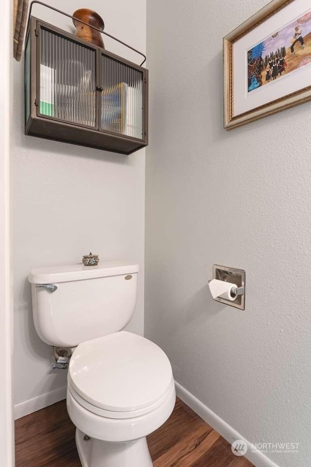 bathroom featuring toilet and hardwood / wood-style floors