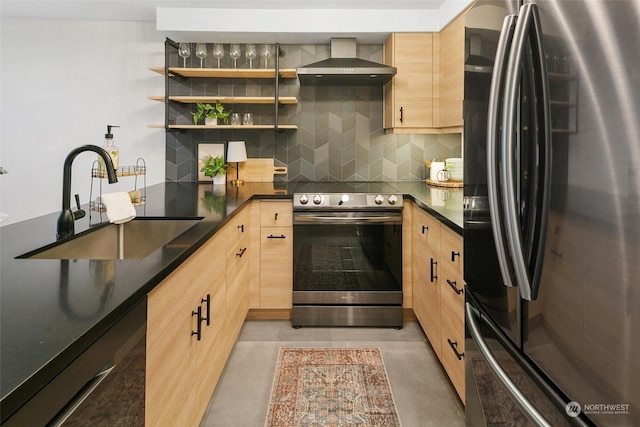 kitchen featuring light brown cabinets, stainless steel appliances, wall chimney exhaust hood, and sink