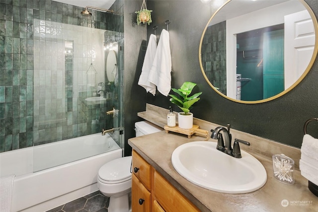 full bathroom featuring tile patterned flooring, vanity, shower / bath combination, and toilet